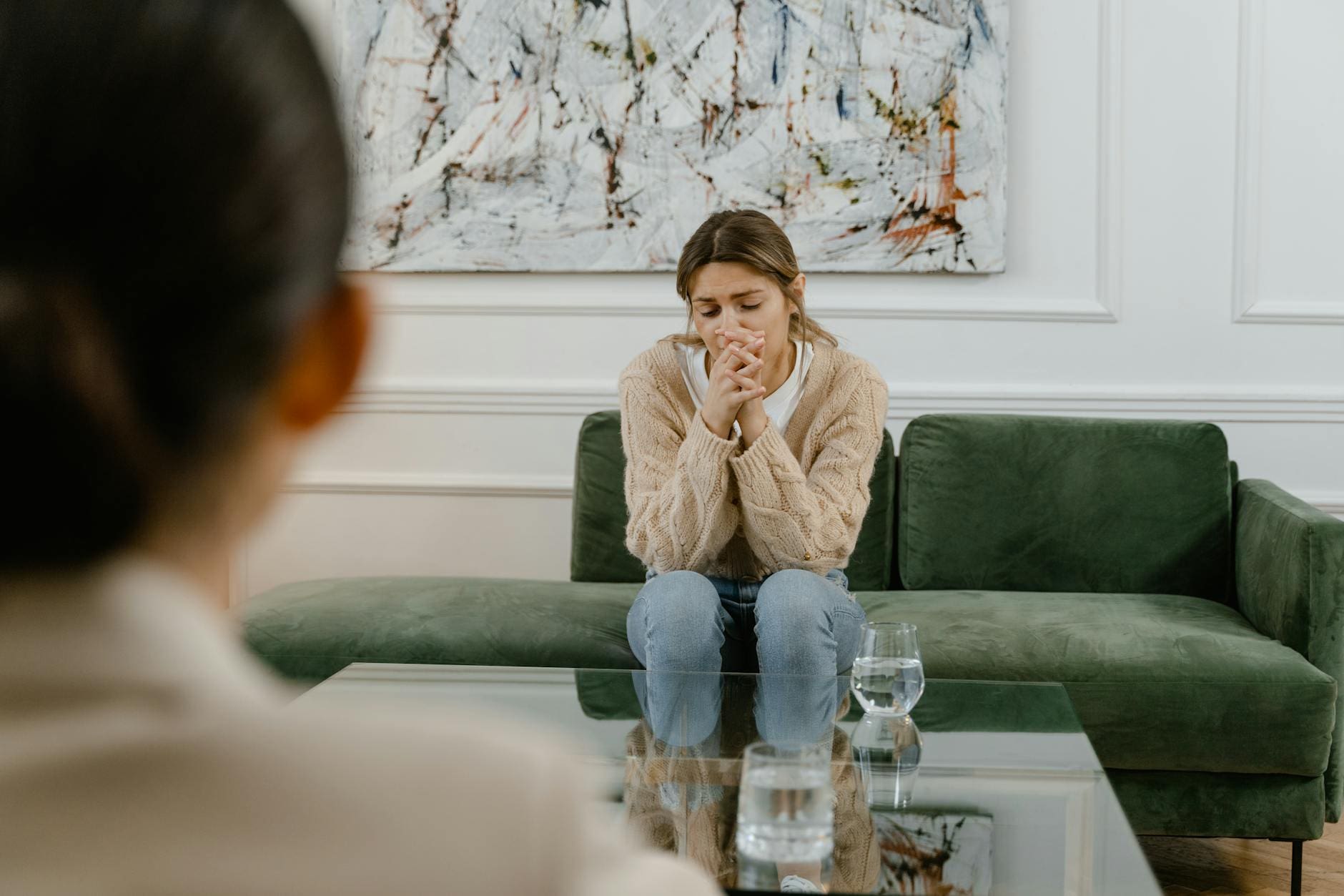 person leaning on wall