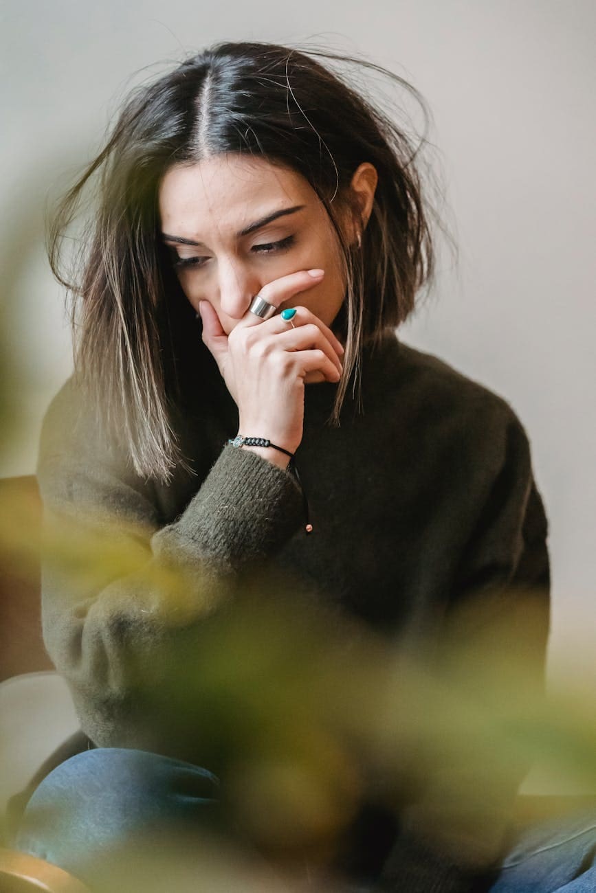 person leaning on wall